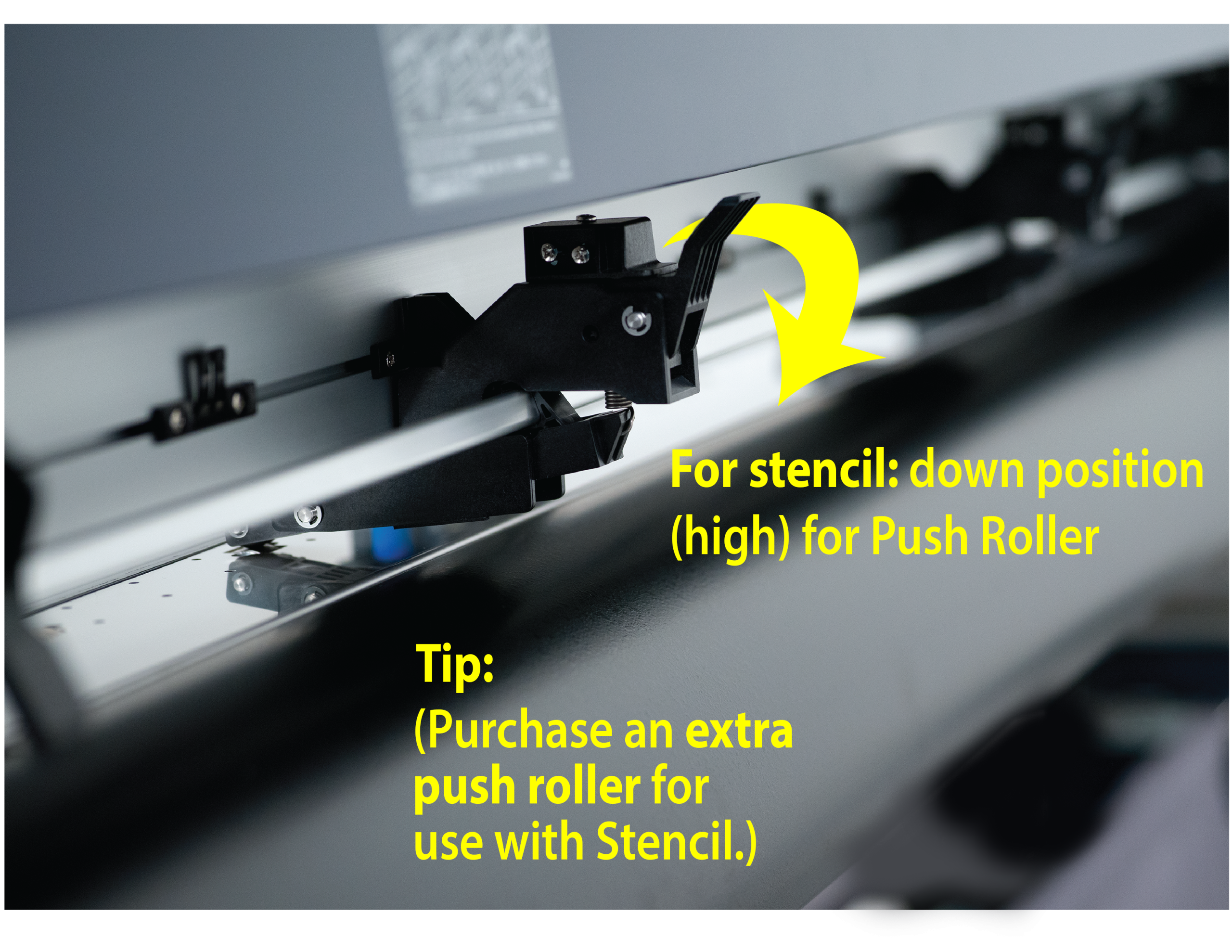 FC9000-DETAIL-PushRoller | Miles Supply Close-up of a machine component with yellow instructional text about lowering the push roller for stencil, arrow pointing downward.